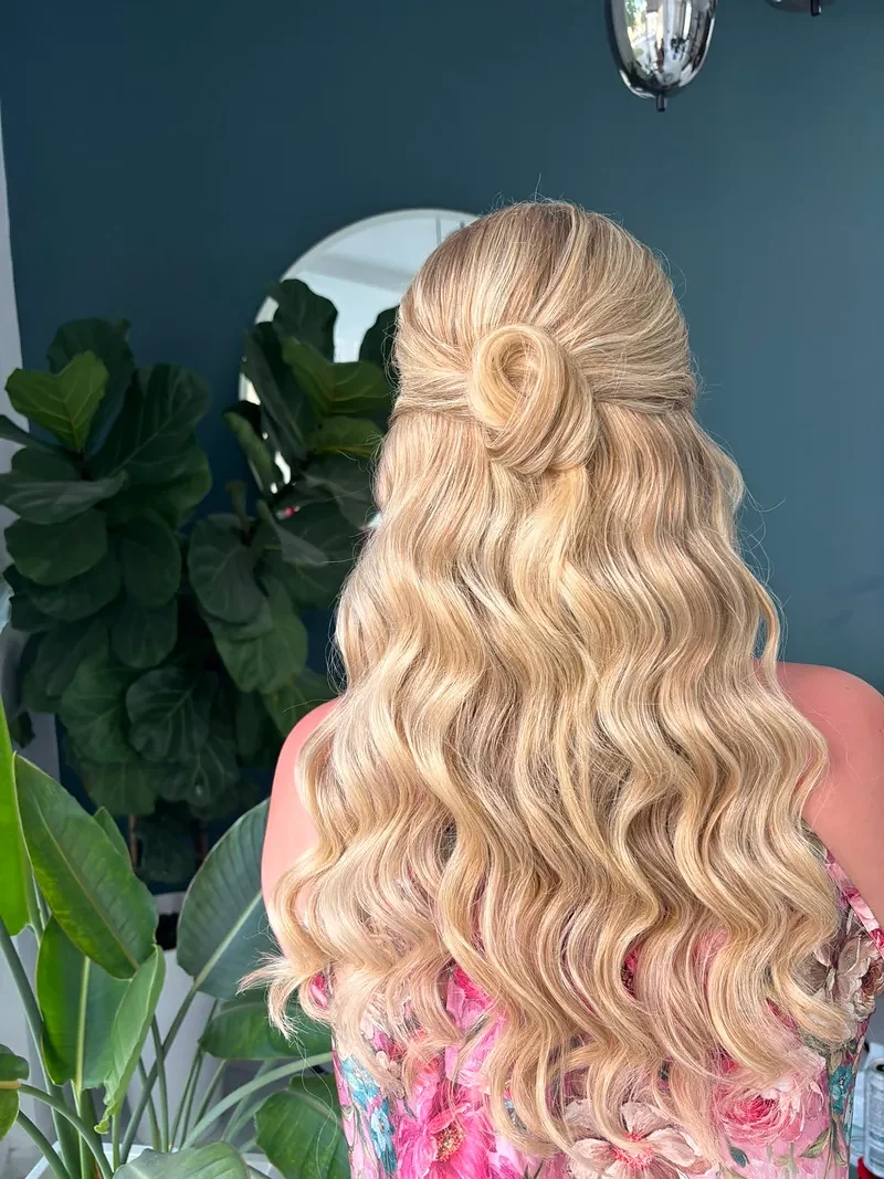 Long blonde waves with a half-up twist for an occasion